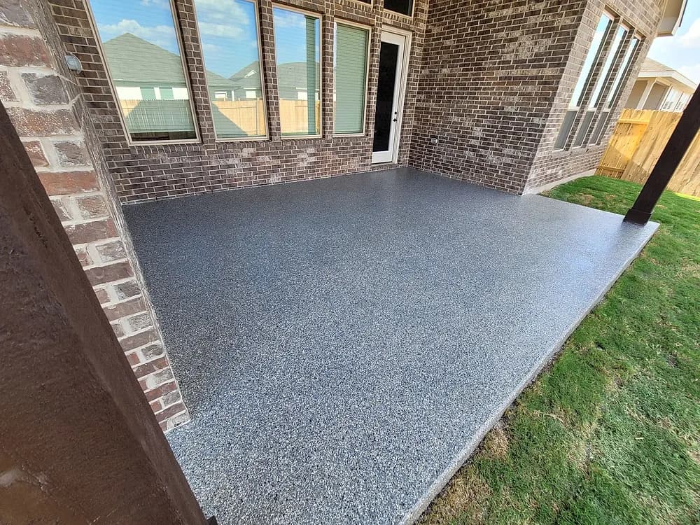 Patio corner where the coating meets the lawn